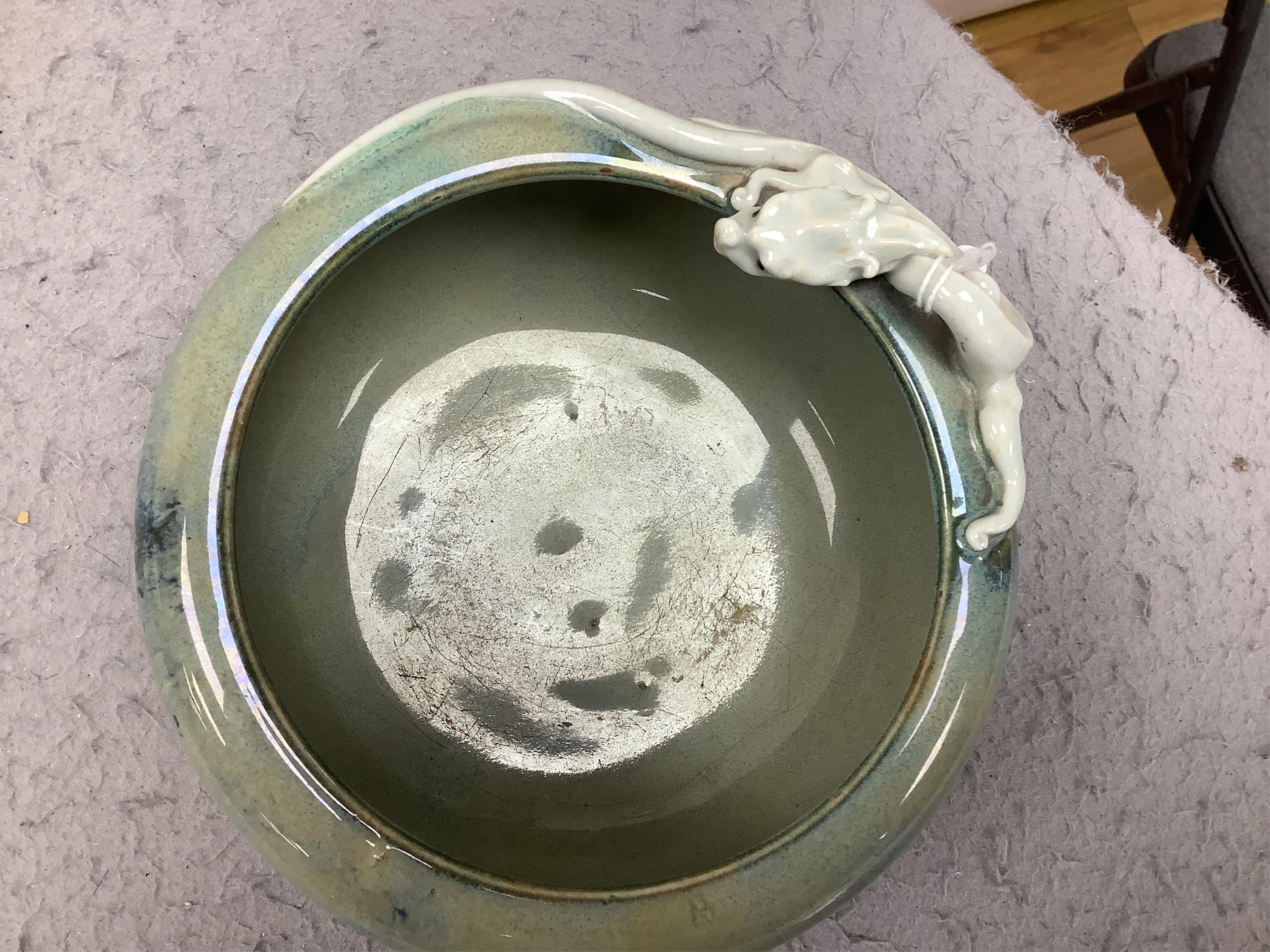 A Japanese Sumidagawa ware ‘dragon’ bowl, Meiji period, signed Ishiguro Koko, wood stand. Condition - scratching and crazing to the glaze on the interior otherwise good.